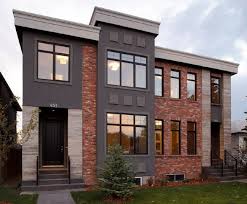 This industrial style exterior of the house is bold and renders a feeling of vigour. Stucco And Brick House Ideas