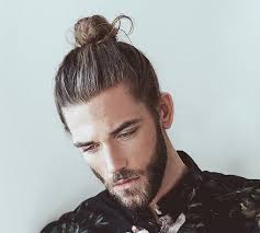 Thinking about getting a man bun or top knot? 21 Man Bun Styles Keep Your Long Hair Pulled Back Looking Stylish Long Hair Styles Men Man Bun Hairstyles Hair And Beard Styles