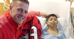 Texans' J.J. Watt delivers football jerseys to injured boy in hospital