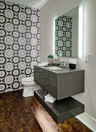 Caesarstone has an outstanding performance quality, and in a we only have to turn lights on in the powder room at night now, it creates a whole mood unto itself. Contemporary Condo Gets Powder Room Refresh Boyer Building Corporation