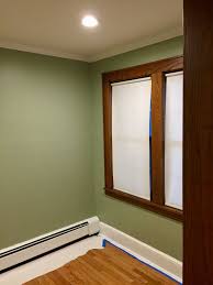 Walls Painted With Sherwin Williams Ovation Clary Sage Stained Window Trim And Natural Color Oak Wood Floor Wood Window Trim White Baseboards Sage Green Walls