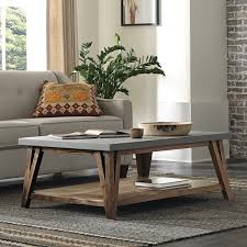 A timber coffee table is made from reclaimed wood and gives a rustic feel to any room. Carbon Loft Omer 48 Inch Concrete Coated Top Wood Coffee Table Overstock 29871407