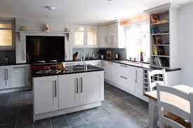 Window front cabinets are featured on top and can be used to display china. Kitchen With White Cabinets And Tile Floor Google Search Slate Floor Kitchen Slate Kitchen Kitchen Flooring