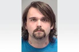 Adrian man charged in video store exposure case