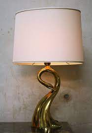 The swan table lamp was designed by malin lundmark for globen lighting with a soft and elegant design that resembles the noble swan. Italian Brass Swan Table Lamp From Regina 1970s 76895