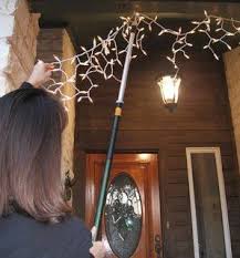 A must have for retail stores, reach high hanging clothing or setting up displays. Robot Check Hanging Christmas Lights Christmas Lighting Christmas Light Hanging Pole