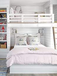 In A Small Room A Dual Bunk Bed Makes Space For The Whole Family The Queen Size Bed On The Bottom And Twin Bunk Bed Designs Bunk Beds Built In Guest