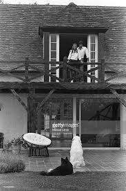 Attitude And Smiling Sheila Ringo Has A Wooden Balcony Of Their House Feucherolles Photo Lamp Post