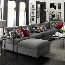 A Clean Modern Look With A Shock Of Red Accent Pillows We Love This Look By Bassett Furniture In 2020 White Walls Living Room Living Room Grey Living Room White