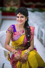 A Classic Wedding Tale With A Lot Of Contrasting Colours In It South Indian Hairstyle Indian Bridal Hairstyles Bridal Blouse Designs