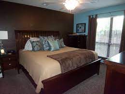 Crisp white walls and trim add a . Blue Brown Master Bedroom Like The Accent Wall But In A Lighter Blue Living Room Decor Apartment Brown Master Bedroom Brown Living Room Decor