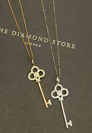 Ideal As A 21st Birthday Or Graduation Gift Your Lucky Recipient Is Guaranteed To Love This Diamond And White G Key Pendant Diamond Stores Gold Chain Necklace