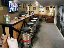 This wet bar uses rich colours in contrast to the light colours elsewhere in the open concept basement. 71 Awesome Home Bar Ideas