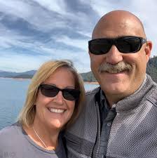 Can I move a rose plant to a better location for sunlight?