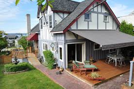Retractable awning mounted to a specially made header board and mounted on the roof. Six Questions To Ask Before You Buy An Awning Rainier Shade