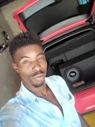 There's a sheep in field been like this since this morning not moved not  sure who it belongs too