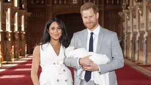 Meghan Markle and Prince Harry pose for 1st photos with royal baby