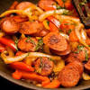 Using a spoon, remove any excess oil that the sausage has rendered and discard. 3