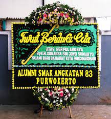 Karangan bunga ucapan duka cita beragam jenis rangkaian bunga papan duka cita, standing, bunga salib dan lainnya pengiriman ke jakarta, bandung, tangerang Karangan Bunga Turut Berduka Cita Alumni Smak Angkatan 83 Purwokerto Hartini Florist