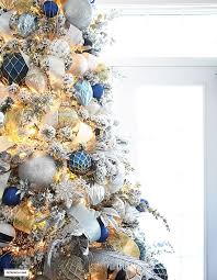 Flocked Christmas Tree Decor Blue Silver Gold Citrineliving Blue Christmas Tree Decorations Gold Christmas Decorations Outdoor Christmas Decorations
