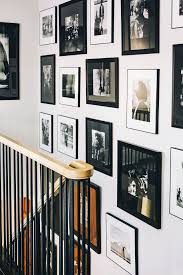Black And White Gallery Wall Stairs This Restored 18th Century Maine Farmhouse Is An Artist S Treasure Trove Gallery Wall Gallery Wall Staircase Stone Fireplace Surround