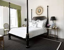 White accents balance a black wall and black bed, creating a bedroom that feels as cozy as can be. 27 Striking Black And White Bedrooms Black And White Bedroom Decor