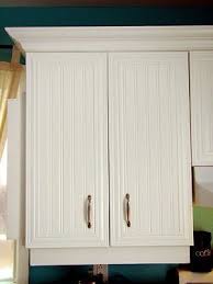 Beadboard island and cabinet doors with wallpaper for added character in your kitchen, add beadboard wallpaper to the faces of cabinet doors and your cabinet end caps. 18647785927495032 Caros Thrifty Adventures New Kitchen Cabinets Diy Beadboard Cabinets Beadboard Kitchen Beadboard Kitchen Cabinets New Kitchen Cabinets