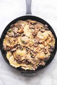 Ravioli With Mushroom Cream Sauce Is A Creamy Savory Smooth Garlicky Comfort Food Treat Of A Meal O In 2020 Stuffed Mushrooms Ravioli Recipe Mushroom Cream Sauces
