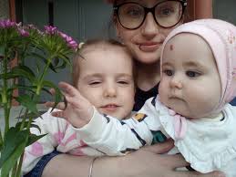 Can someone please move the eyes of the older lady and boy closer to the  camera (have them face the camera better). Thank you!