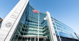 Securities and exchange commission seal hangs on the facade of its building in. Us Sec Shoots Down Latest Bitcoin Etf Commissioner Crypto Mom Dissents On Ruling Blockchain News