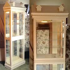 This oak cabinet is great for displaying your collectibles. Pulaski Dollhouse 7 Shelf Curio Cabinet Locking Lighted Mirror Back Display Case 17165 Beige Pick Up Only