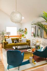 This modern glam bedroom uses shiny and lustrous fabrics, metallics and hues of grey, silver and black to create a glamorous and modern bedroom design. Vibrant Mid Century Glam Living Room Refresh The Reveal Jessica Brigham