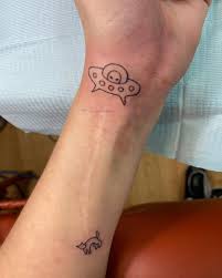 Attractive black and grey alien tattoo on left shoulder black alien head tattoo on ankle by ivaasykes black alien head tattoo on right side rib black and grey 3d alien head tattoo on man right shoulder by stepan negur Updated 50 Out Of This World Alien Tattoos August 2020