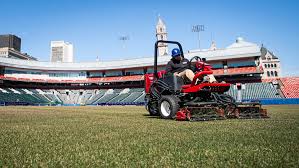 Crews prep the outfield for Opening Day at Sahlen Field