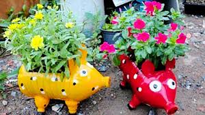 I use a hot nail to make drainage holes in the plastic. Diy Recycled Plastic Bottle Piggy Planters Diy Ways