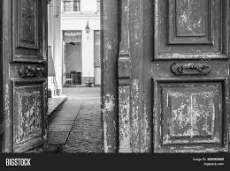 For wooden doors with flaking if your front door is bare wood, you'll still be able to see the grain after two coats so will need a third. Black White Photo Image Photo Free Trial Bigstock
