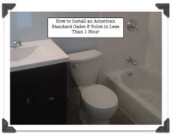 Replace the hinge covers, and place the seat back onto the toilet hinges. American Standard Cadet 3 Installing A Toilet Can T Get Easier