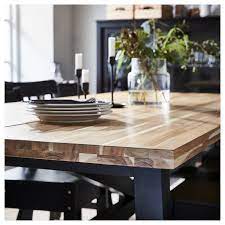 If i'm going to navigate that maze of room displays that culminates in an endless sea of stacked boxes, the they took the traditional plank table, popular in scandinavian design, and brought it into the 21st century with handsome steel accents. Skogsta Acacia Dining Table Ikea