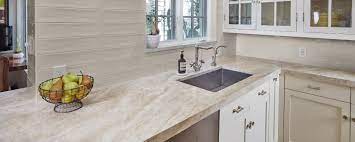 Part of the reason for the extra cost is that quartzite tends to be rarer than granite, and the process to quarry it is a bit more complex than the process to quarry granite slabs. Taj Mahal Satin Gioia Greige Taj Mahal Quartzite Kitchen Interior Quartzite Countertops Kitchen