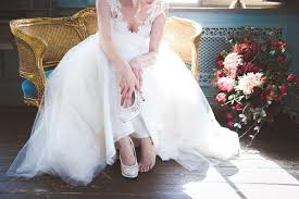 Bride Is Putting On Her Shoes Bride Wedding Dresses Put On