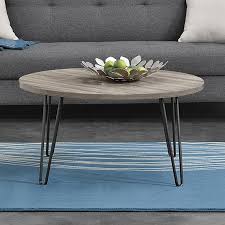 Tape off sections to form a grid and position objects within the squares. Best Owen Coffee Table Idea