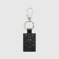 Black Gucci Signature Key Ring Gucci Us Authenticity pamphlet, box and plastic packaging. gucci signature keychain