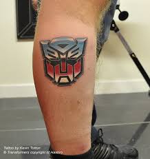 Bumblebee transformer tattoo on side thigh. Kt Transformers The Iconic Transformers Autobots Badge On Flickr