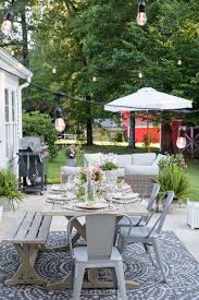 This is because these types of patios already have somewhere to hang lights from. Affordable Patio Entertaining How To Easily Hang Outdoor String Lights Without Trees