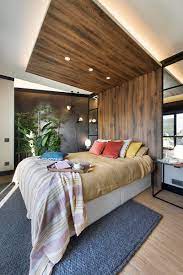 Maybe you would like to learn more about one of these? A Wrap Around Wood Headboard Helps Define The Bed S Space In This Room