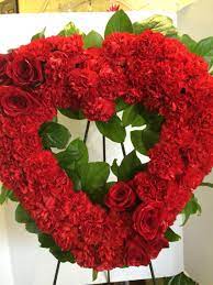Flowers of this style can still be made into traditional funeral arrangements. Red Roses And Red Carnations Open Heart
