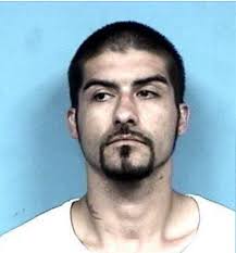 Murder suspect with “Scooby Doo” tattoo still hiding from police