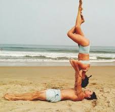 Acroyoga Flyer Does Shoulder Stand Eagle Pose On Base S Hands While Holding Onto Base S Arms Acro Yoga Yoga Postures Exercise