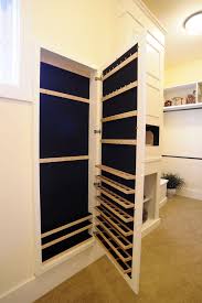 This closet space is designed to be hidden as a custom bookcase, but behind the shelves is a lock to open the safe. Cabinet Built Around Gun Safe Cabinet Chasseur