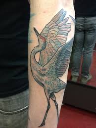 Pretty geometric crane nape tattoo image credit: Flying Crane Tattoos On Man Chest